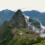 green mountain under white clouds during daytime